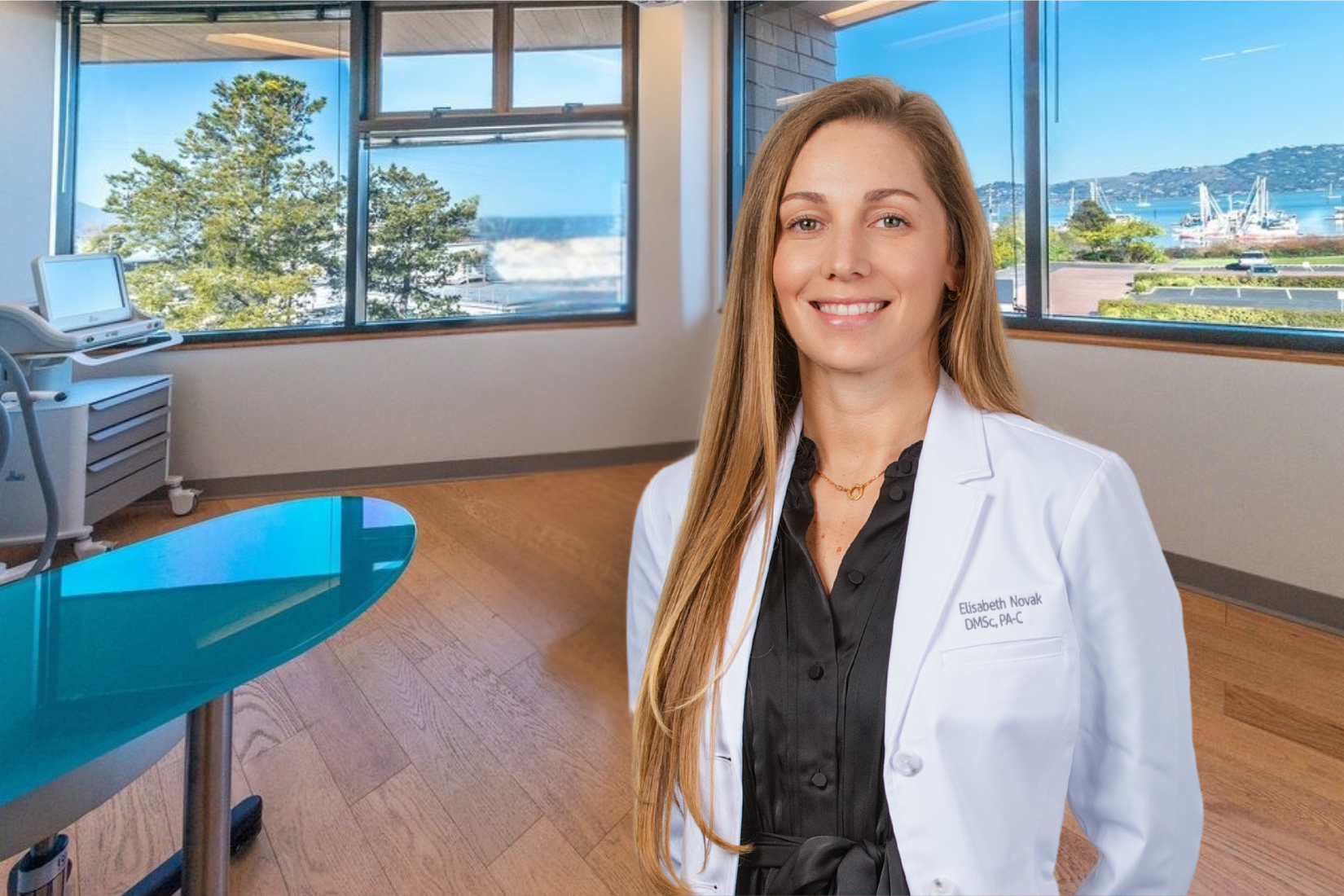 Photo of Elisabeth Novak, DMSc, PA-C, in their white lab coat standing in front of our cosmetic exam room.