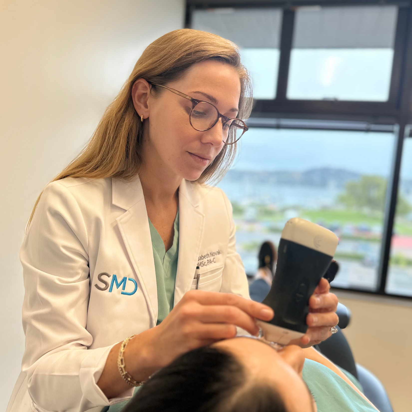 Elisabeth Novak, DMSc, PA-C, using facial ultrasound to guide safe and precise cosmetic filler treatment at Southern Marin Dermatology