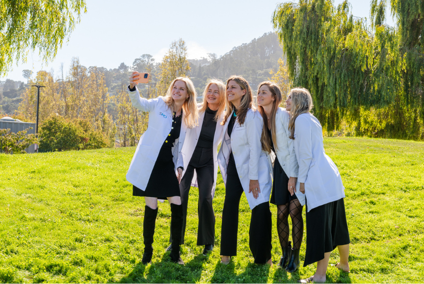 Southern Marin Dermatology providers taking a fun group selfie at a team photoshoot
